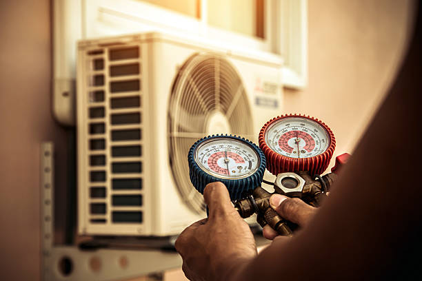 Professional Air Conditioning Service technician working in New Richmond, IN